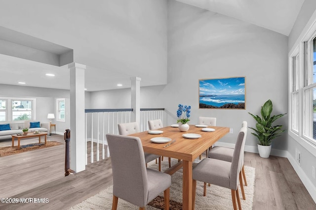 703 Stone Rd, Union Beach, NJ 07735 - dining space with ornate columns, light wood-style flooring, baseboards, vaulted ceiling, and recessed lighting