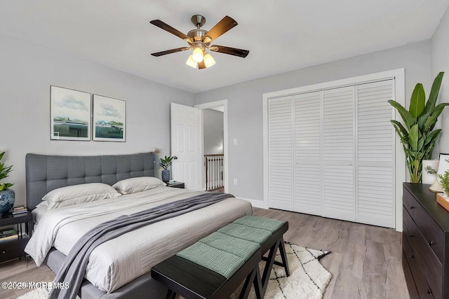 703 Stone Rd, Union Beach, NJ 07735 - bedroom with a closet, light wood-type flooring, and ceiling fan