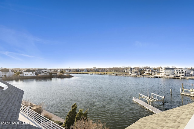 view of dock with boat lift and a water view