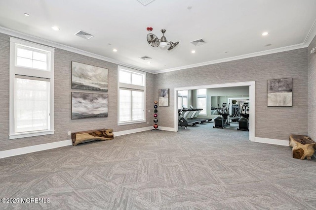 exercise room featuring a wealth of natural light, visible vents, and baseboards