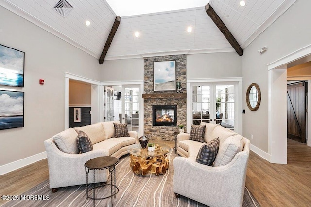 living area featuring high vaulted ceiling, baseboards, and beam ceiling