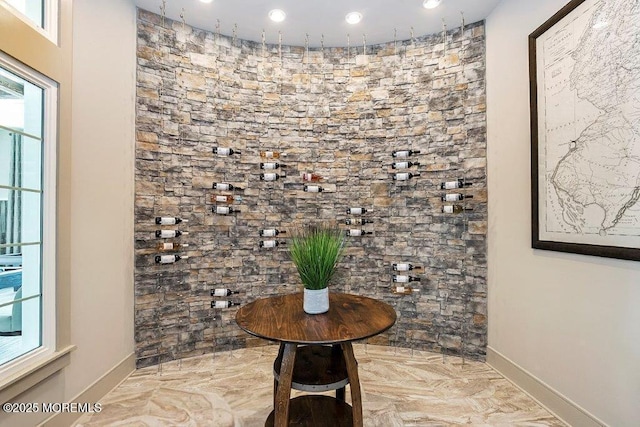 wine cellar with baseboards and recessed lighting