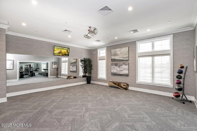 workout room featuring visible vents, baseboards, and a healthy amount of sunlight