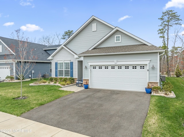 view of front of home with a shingled roof, stone siding, a garage, a front lawn, and driveway