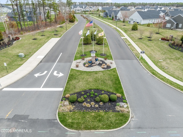view of road featuring curbs and a residential view