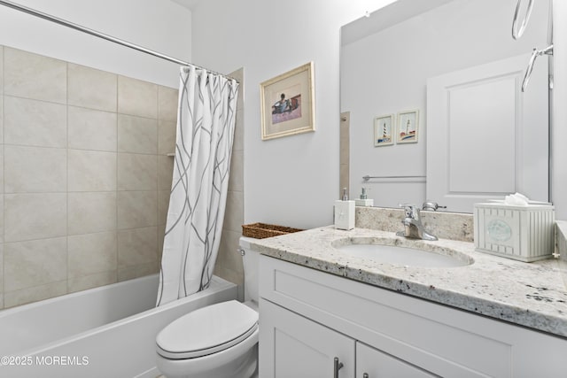 bathroom featuring shower / bath combo with shower curtain, vanity, and toilet