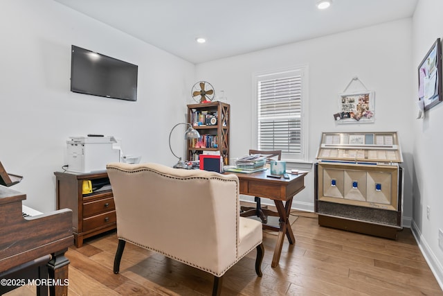 home office featuring wood finished floors, baseboards, and recessed lighting