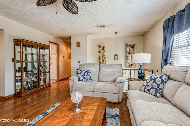 438 Carlisa Dr, Brick, NJ 08723 - living area with a textured ceiling, wood finished floors, and ceiling fan