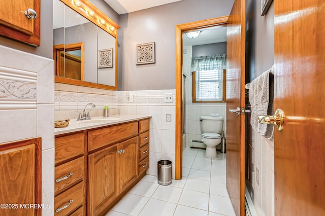 438 Carlisa Dr, Brick, NJ 08723 - bathroom featuring tile walls, tile patterned flooring, vanity, a wainscoted wall, and a baseboard heating unit
