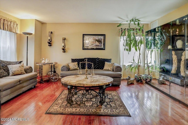 living area with hardwood / wood-style floors