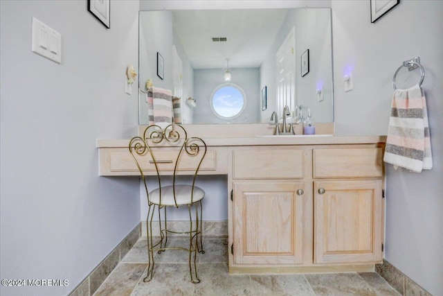 bathroom with visible vents and vanity