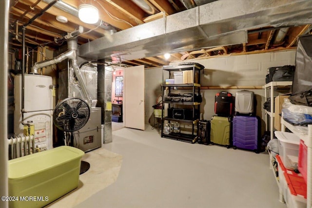 unfinished below grade area with heating unit and gas water heater