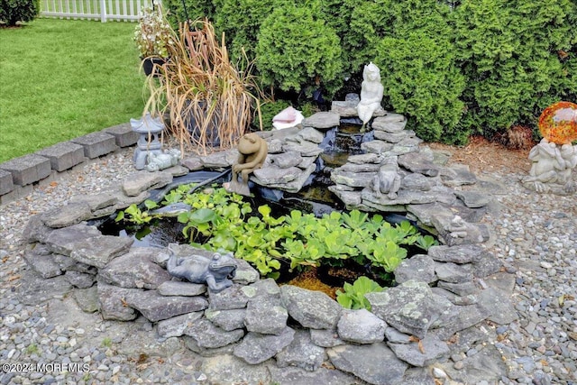 exterior details featuring a small pond