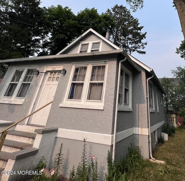 931 Gilbert Ave, Toms River, NJ 08753 - view of front facade featuring stucco siding and entry steps