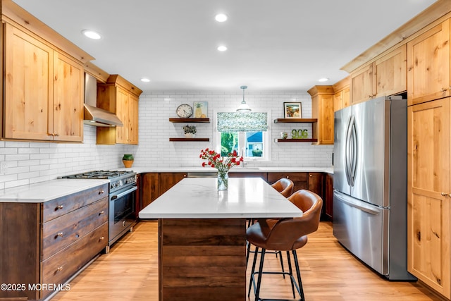 kitchen with stainless steel appliances, open shelves, light wood-type flooring, a kitchen island, and a kitchen breakfast bar