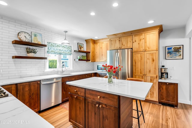 kitchen with open shelves, stainless steel appliances, a sink, light wood-type flooring, and recessed lighting