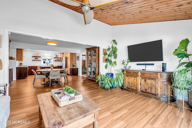 living area featuring wood ceiling, vaulted ceiling, and light wood-style flooring