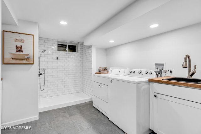 washroom featuring separate washer and dryer, recessed lighting, and baseboards