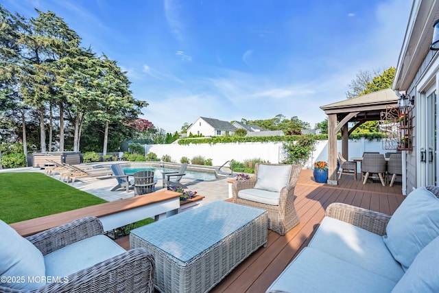 deck featuring outdoor dining space, a gazebo, and outdoor lounge area