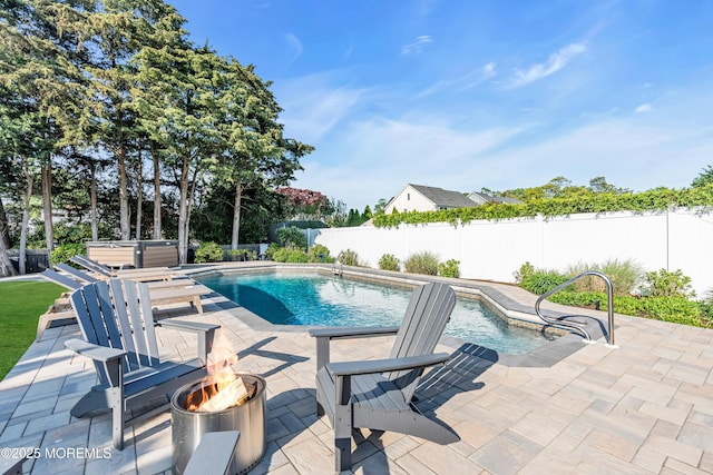 view of swimming pool with an outdoor fire pit, a fenced backyard, and a patio area