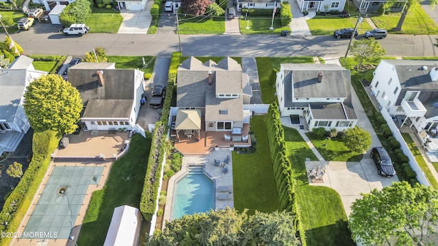 aerial view of residential area with a pool
