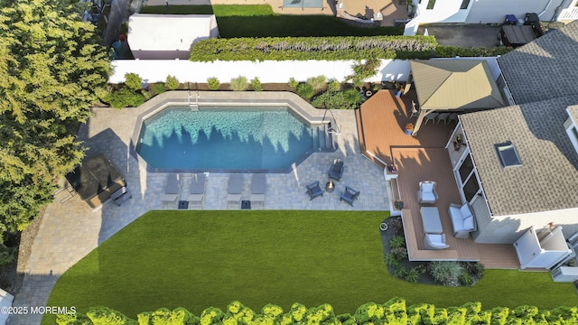 aerial view of property and surrounding area featuring a pool