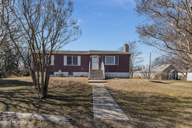 27 Kearney Rd, South Amboy, NJ 08879 - view of front of house with a chimney and a front lawn