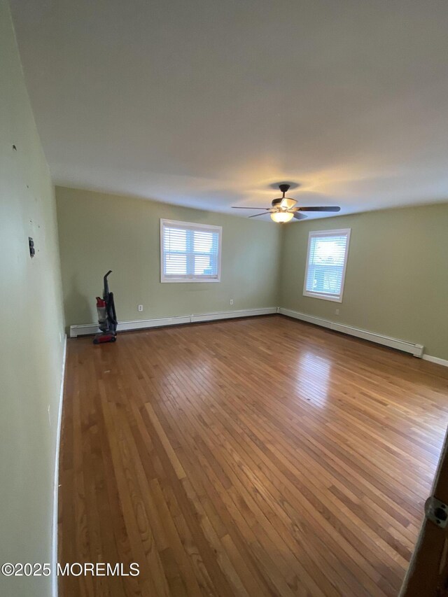 18 Arneytown Hornerstown Rd, Cream Ridge, NJ 08514 - interior space with a ceiling fan, plenty of natural light, hardwood / wood-style flooring, and baseboards