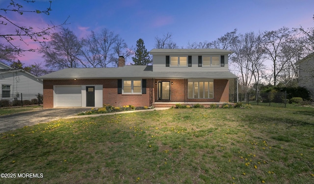 traditional home featuring brick siding, an attached garage, fence, and driveway