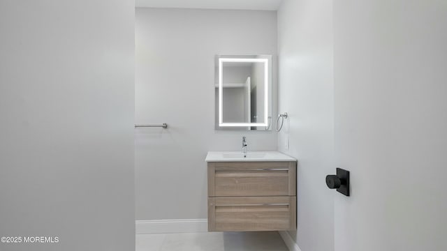 bathroom with baseboards and vanity