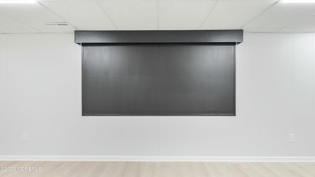 details with visible vents, a paneled ceiling, and wood finished floors