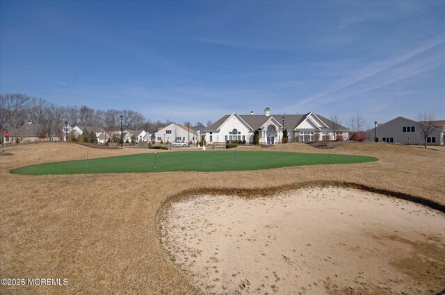view of property's community with a yard and a residential view