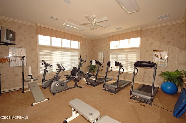 workout room featuring wallpapered walls, crown molding, and visible vents