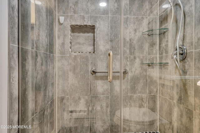 interior details with a shower stall