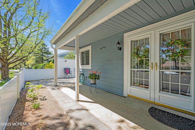view of patio featuring a fenced backyard and french doors