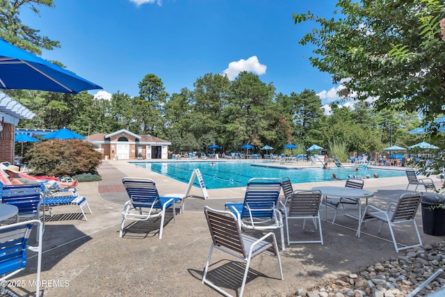 community pool with a patio area