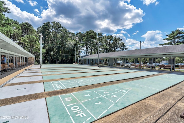 view of home's community featuring shuffleboard