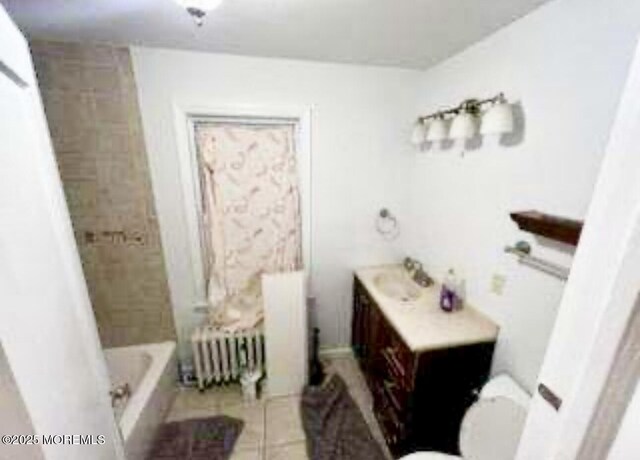 209 Broadway, Keyport, NJ 07735 - bathroom featuring radiator heating unit, toilet, tile patterned flooring, and vanity
