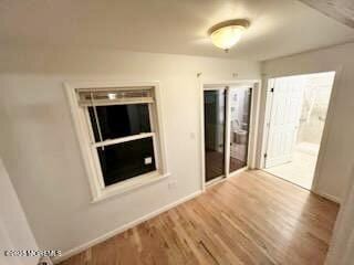 209 Broadway, Keyport, NJ 07735 - spare room with wood finished floors and baseboards
