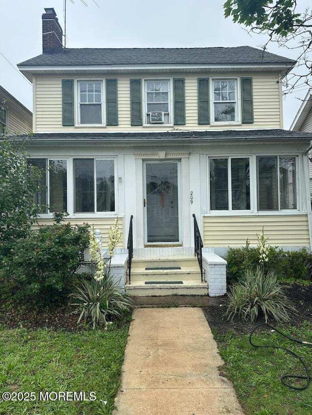 209 Broadway, Keyport, NJ 07735 - view of front of property featuring entry steps, a chimney, and cooling unit