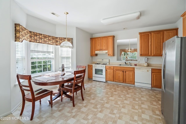 108 Belvedere Dr N, Manchester, NJ 08759 - kitchen featuring white appliances, light countertops, under cabinet range hood, visible vents, and a sink