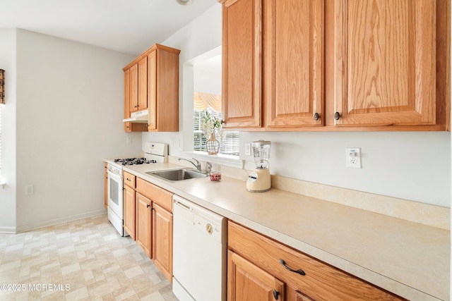 108 Belvedere Dr N, Manchester, NJ 08759 - kitchen with white appliances, under cabinet range hood, light countertops, a sink, and baseboards