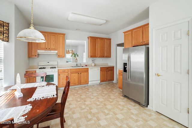 108 Belvedere Dr N, Manchester, NJ 08759 - kitchen featuring white appliances, light countertops, under cabinet range hood, light floors, and a sink