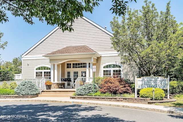 108 Belvedere Dr N, Manchester, NJ 08759 - view of front facade featuring a porch, roof with shingles, french doors, and fence