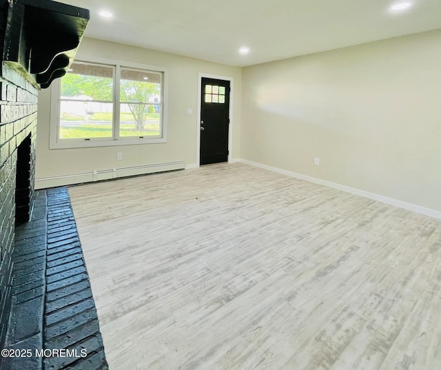 249 Center St, Little Egg Harbor, NJ 08087 - unfurnished living room featuring a baseboard heating unit, a brick fireplace, wood finished floors, and recessed lighting