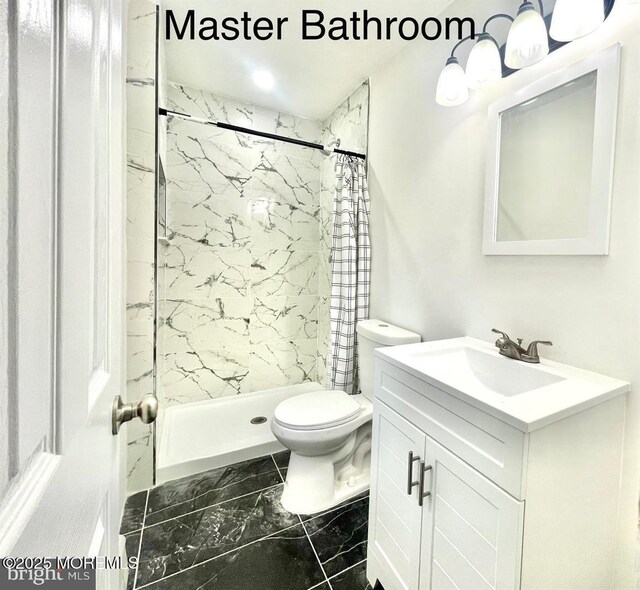 249 Center St, Little Egg Harbor, NJ 08087 - bathroom featuring vanity, marble finish floor, a stall shower, and toilet