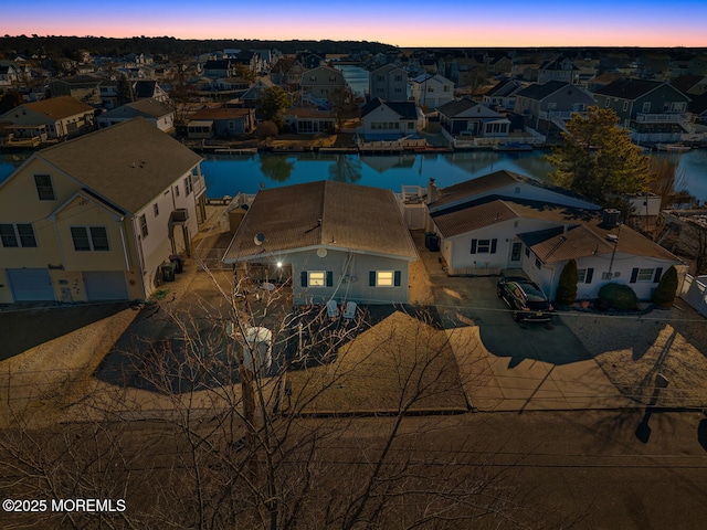aerial view featuring a residential view and a water view