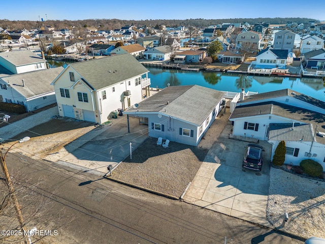 aerial view with a residential view and a water view
