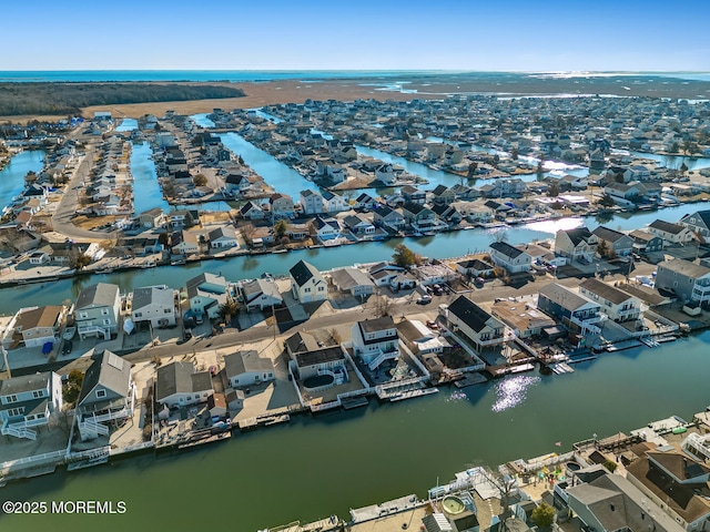 birds eye view of property with a residential view and a water view