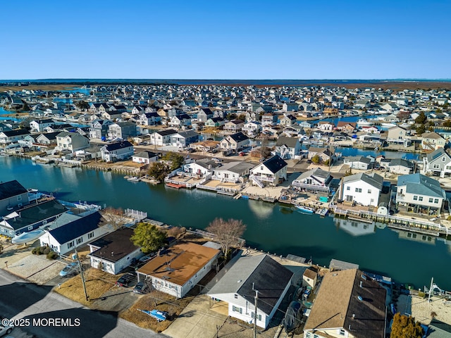 aerial view with a residential view and a water view